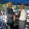 6th Brigade Commander Al Perry presents flag to Thain descendant and World War II Veteran, Willie Harold Thain